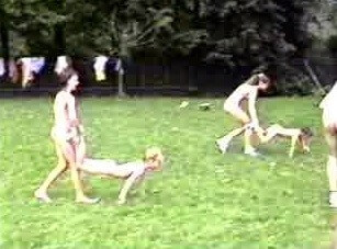 A nudist gathering at the stadium and sports - Living together in nature is a hallmark of nudists
