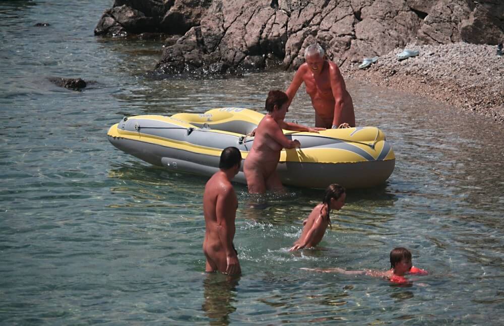 Lone Nudist in Yellow Boat photos - Nudism and naturism help break down stereotypes