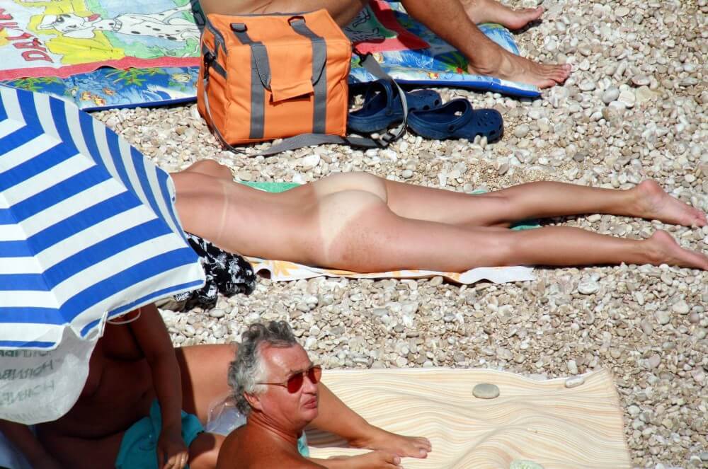 Naturists Beach Relaxation pics - Nudity is perceived as a natural expression of life