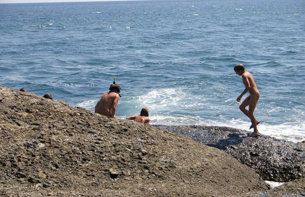 Leaning Against Hit Rocks pics - Nudism strengthens health and self-esteem