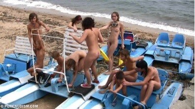 A group of naturists at sea - Complete Natural Nudity